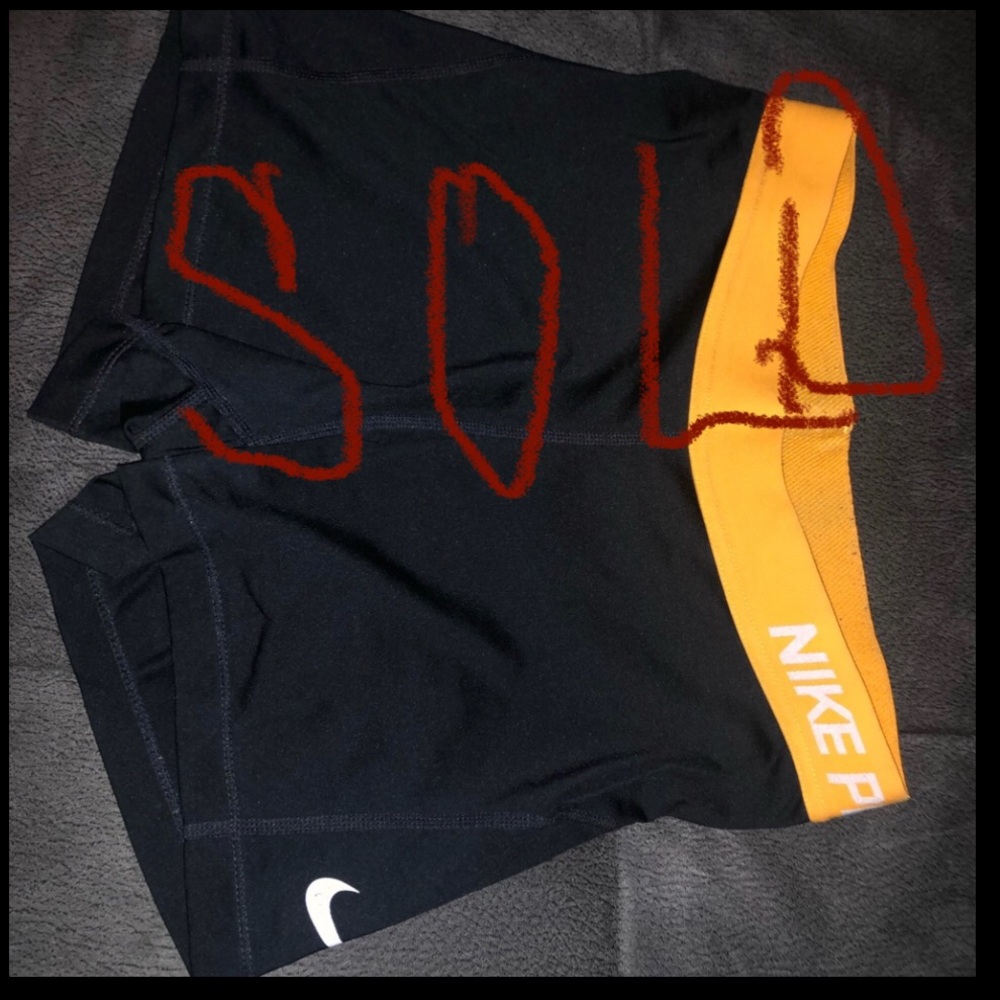 Nike Pro Size Medium Black and Orange. Good used condition. Smoke free home.
